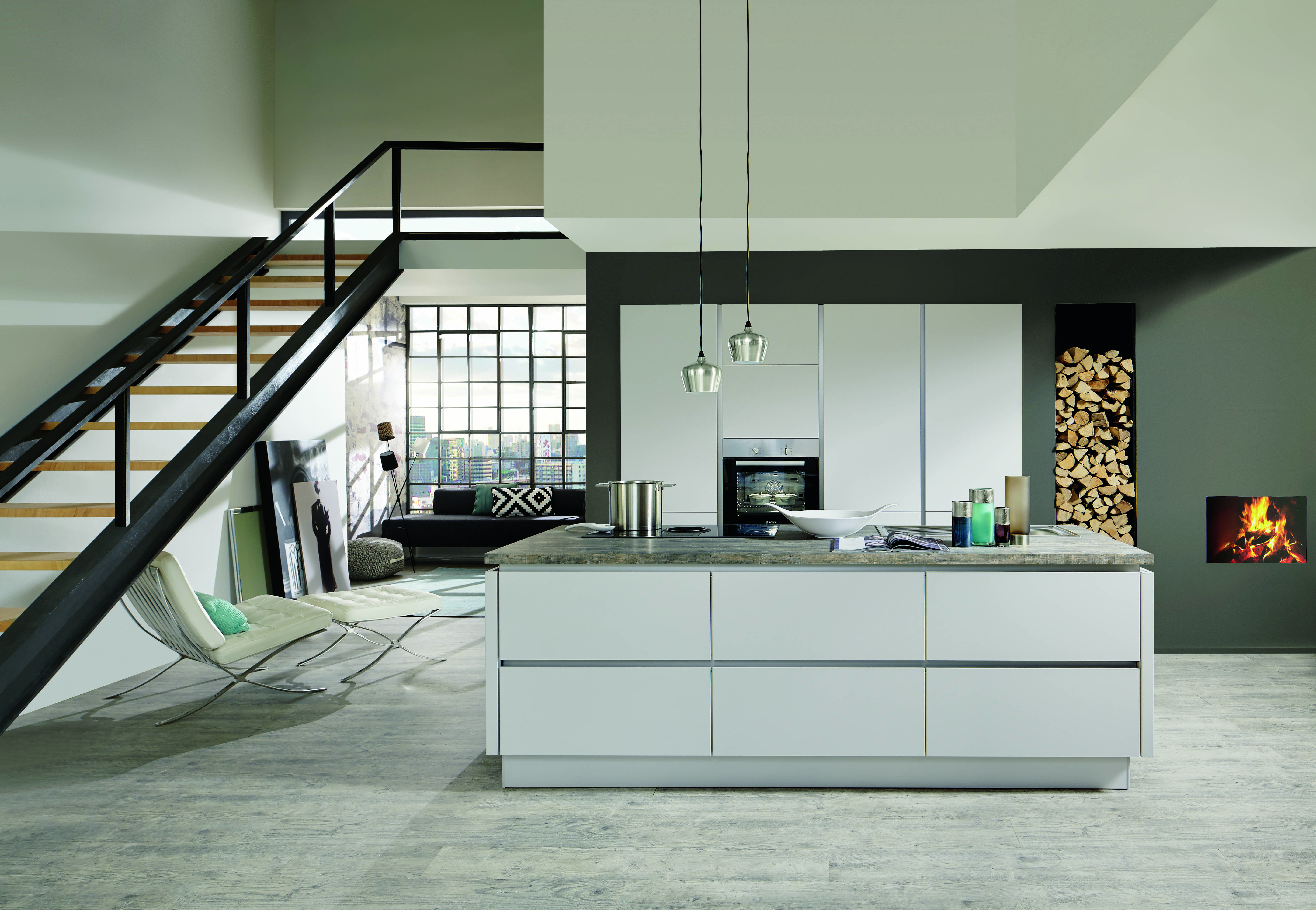 noblessa USA - A sophisticated modern German kitchen featuring sleek white cabinetry, a spacious stone-topped island, integrated appliances, and an open-concept layout that connects seamlessly with the living area and striking architectural details.