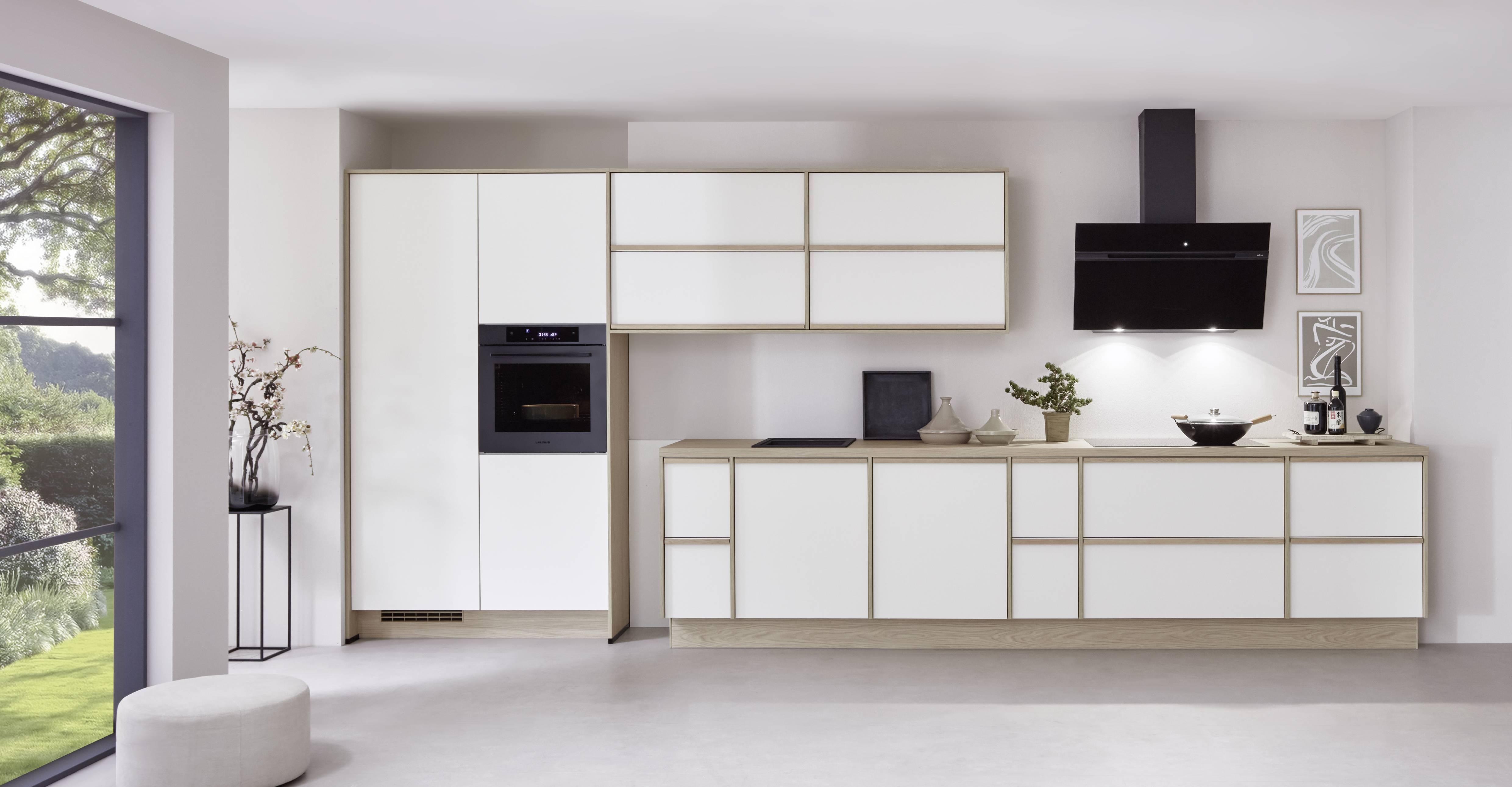 Minimalist solid-front kitchen cabinet design Minimalist white kitchen with solid-front cabinets and light wood accents for a clean, streamlined look