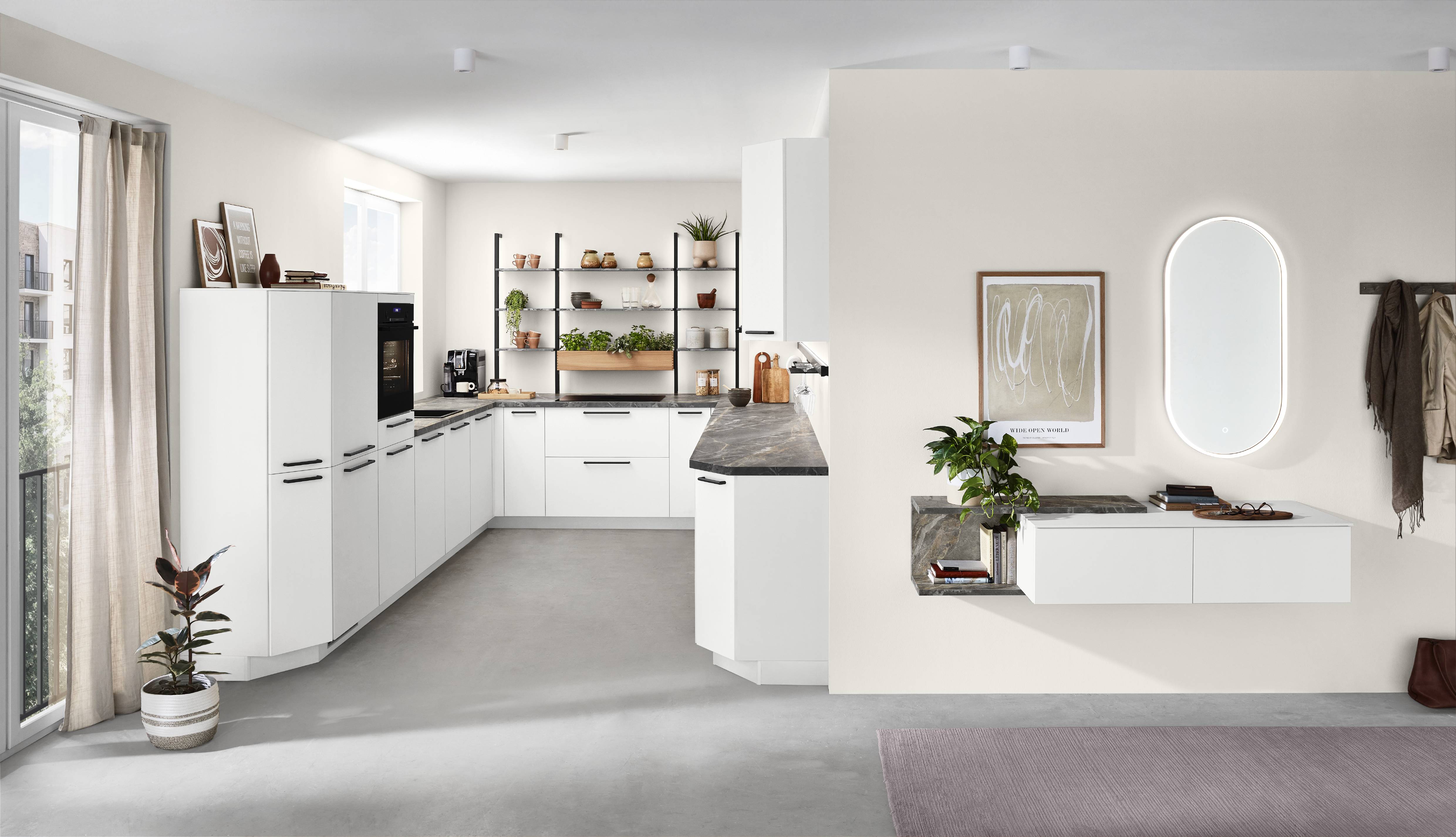 White L-shaped kitchen with open shelving White L-shaped kitchen with tall cabinets, open shelving, and a light neutral palette that feels airy and modern