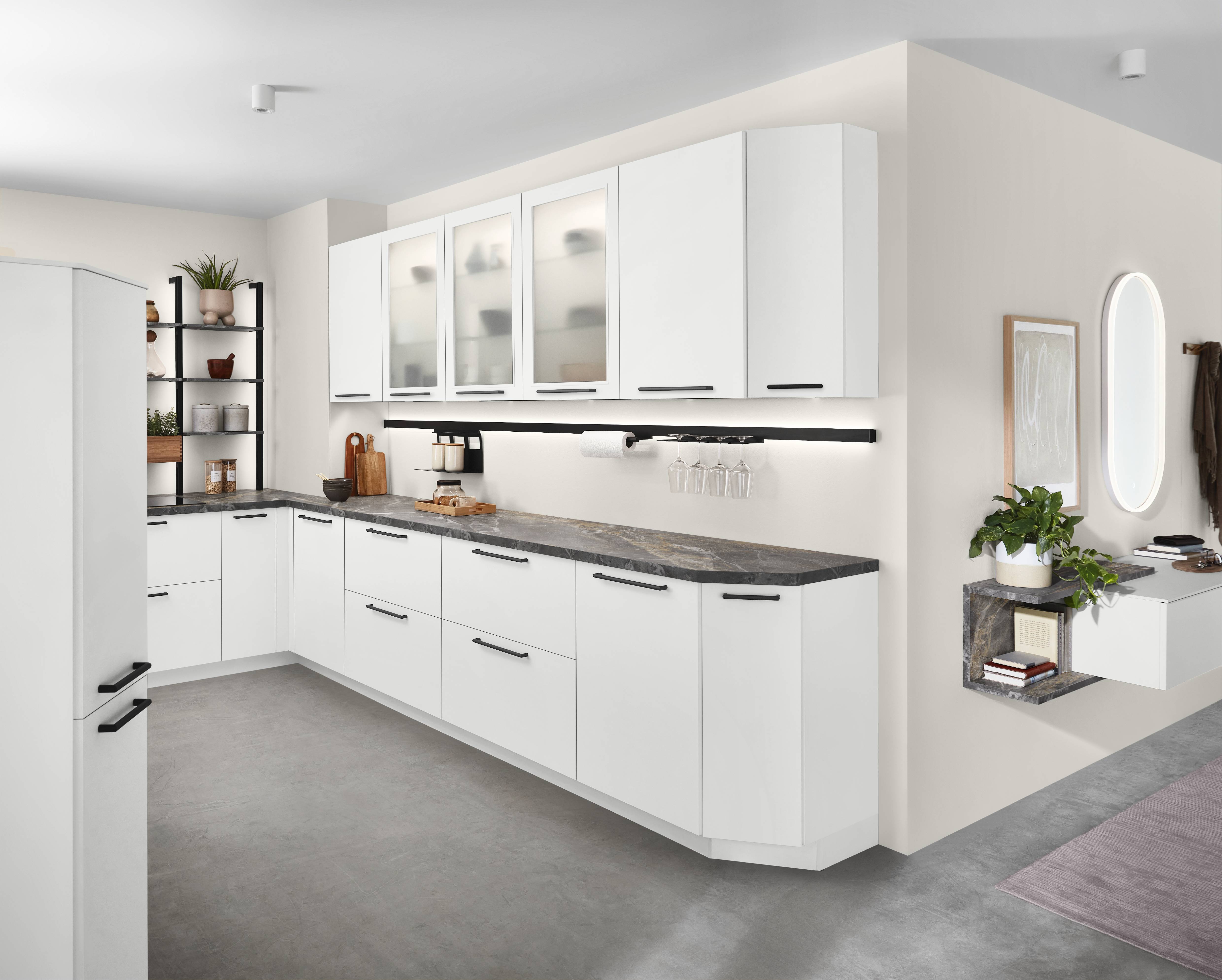 Noblessa USA Modern German Kitchen with White Cabinetry, Frosted Glass Cabinets, and Stone Countertops Modern German kitchen with matte white cabinetry, frosted glass upper cabinets, dark stone countertops, open shelving, under-cabinet lighting, and minimalist black hardware in a bright contemporary home.