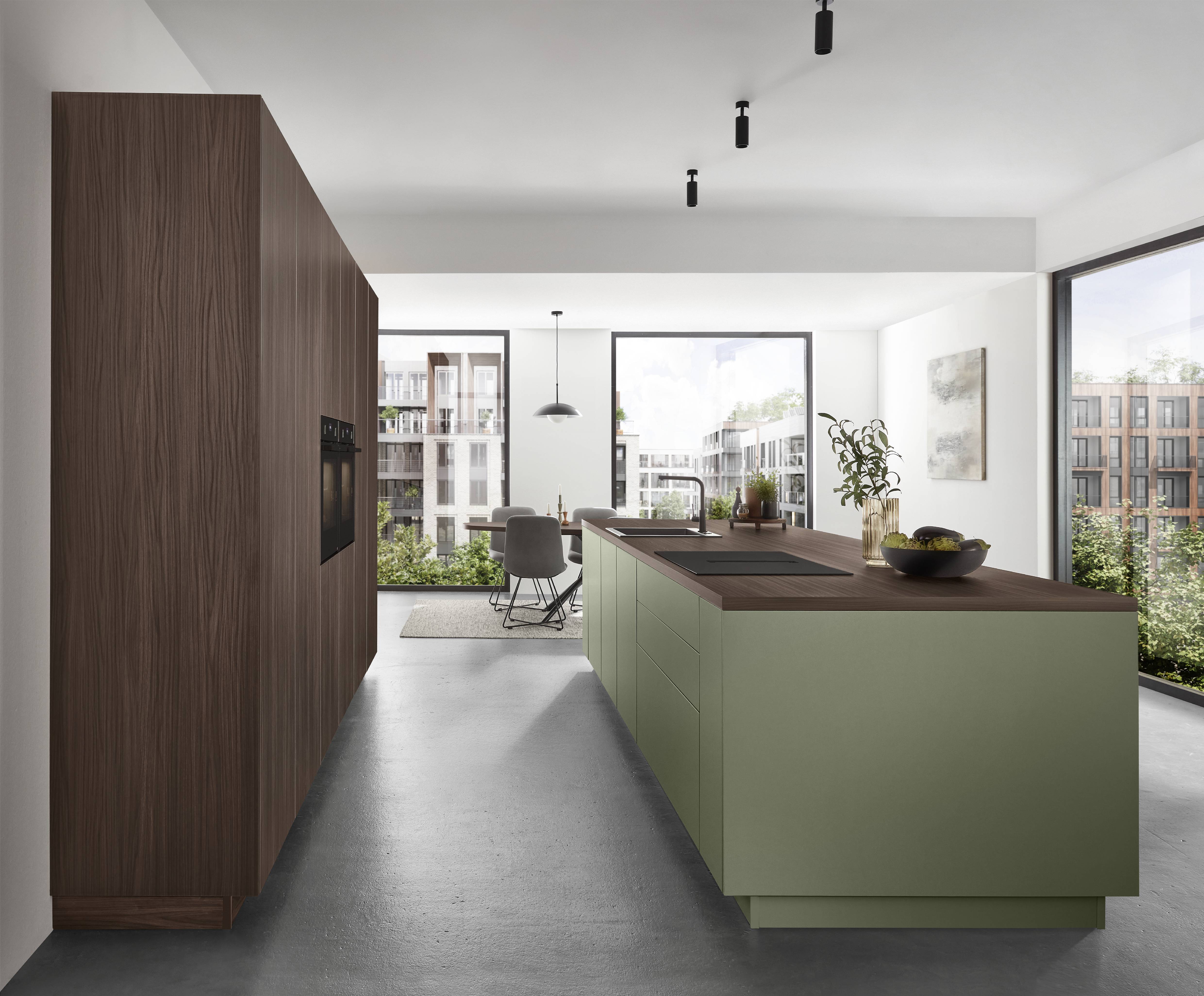 Contemporary kitchen with a large island and streamlined cabinetry in a bright, minimalist interior