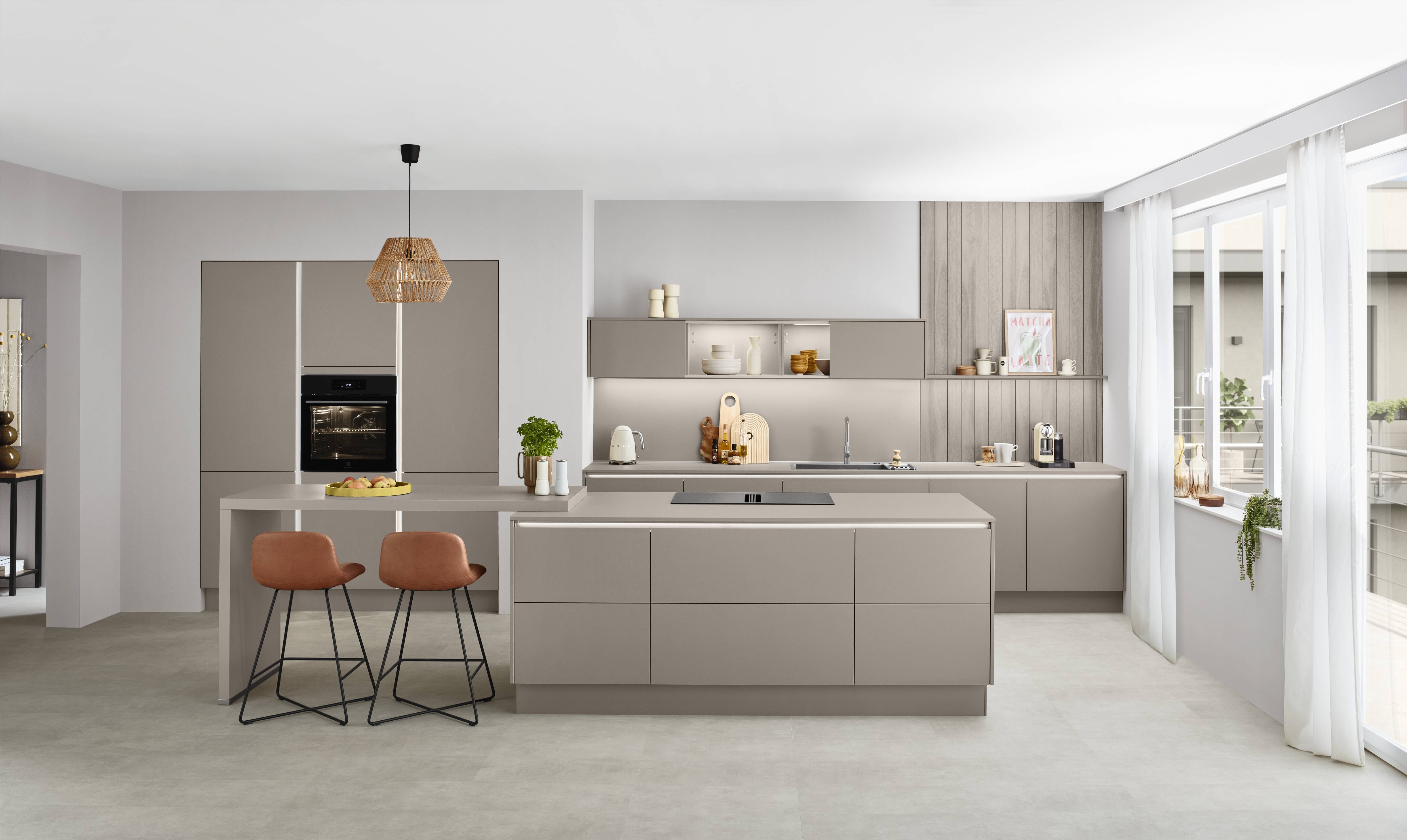 Noblessa USA - Modern German Kitchen with Matte Taupe Cabinetry, Spacious Island, and Minimalist Design Modern German kitchen with matte taupe cabinetry, a large central island with an integrated cooktop, built-in oven, minimalist open shelving, warm wood accents, and expansive windows that brighten the contemporary space.