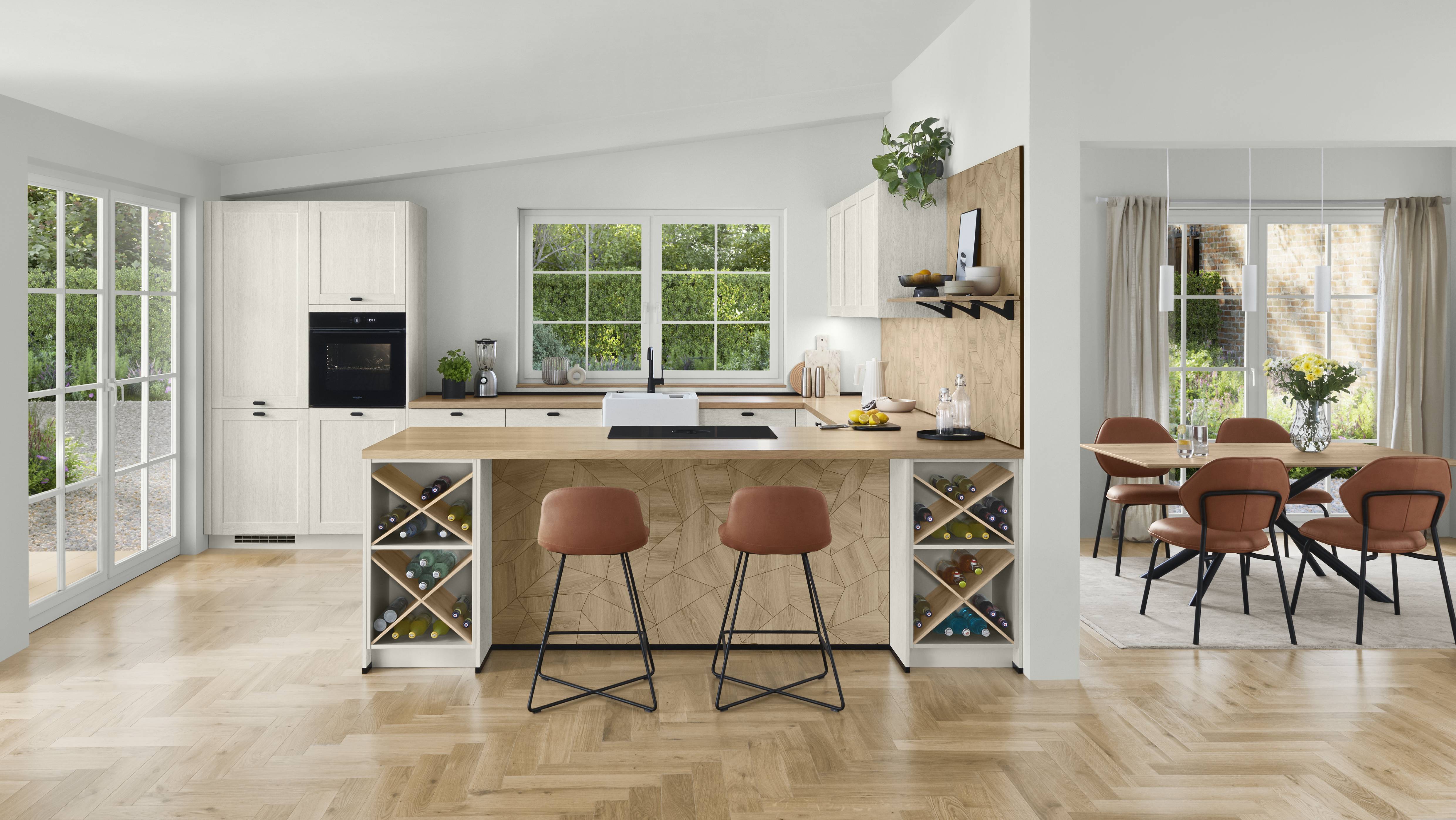 Bright kitchen layout with island seating and warm wood accents Bright kitchen with an island layout, light cabinetry, wood accents, and casual seating centered around a spacious prep surface