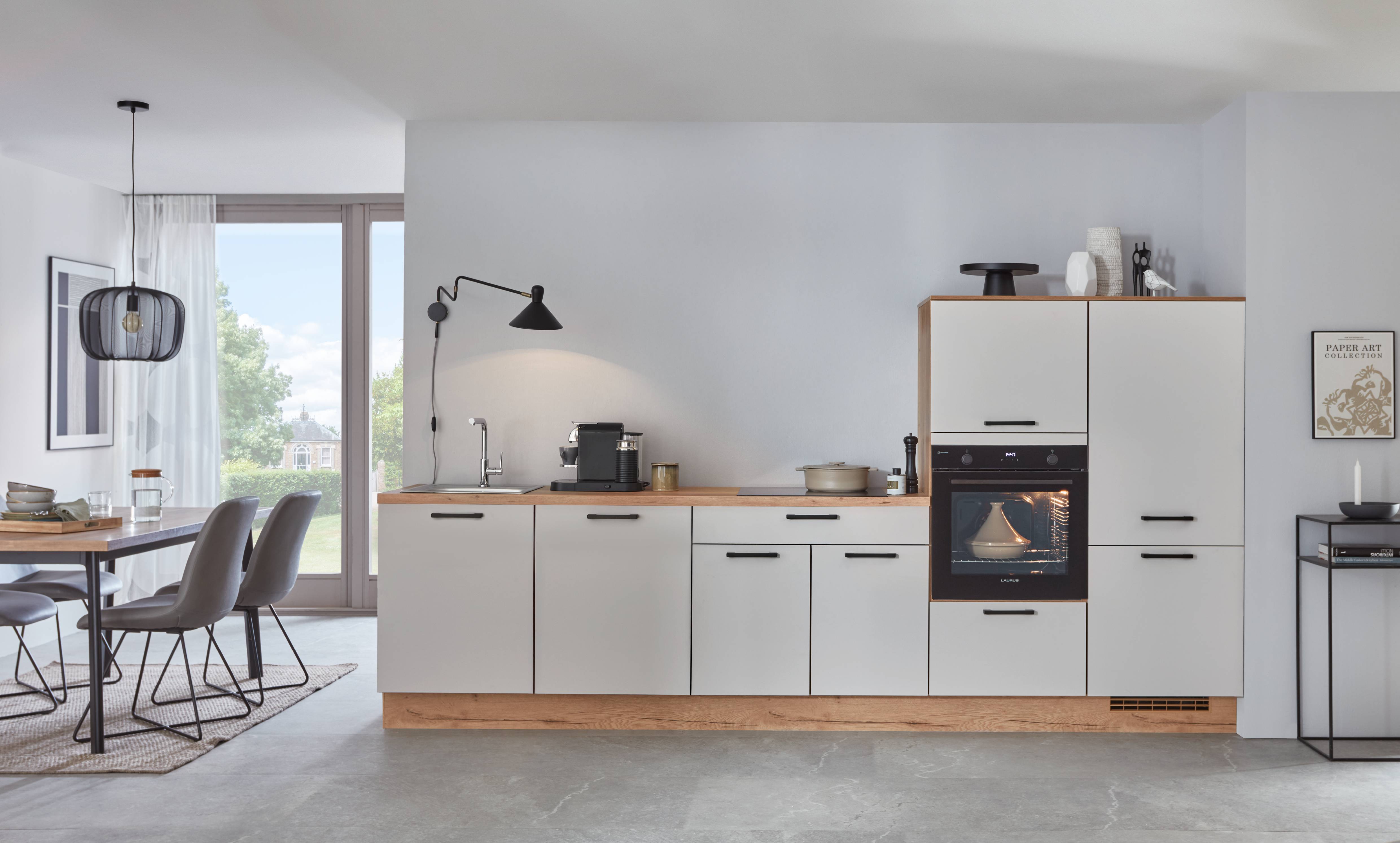 A sleek and modern kitchen featuring minimalist white cabinetry, warm wood accents, and integrated appliances for a clean, functional design.