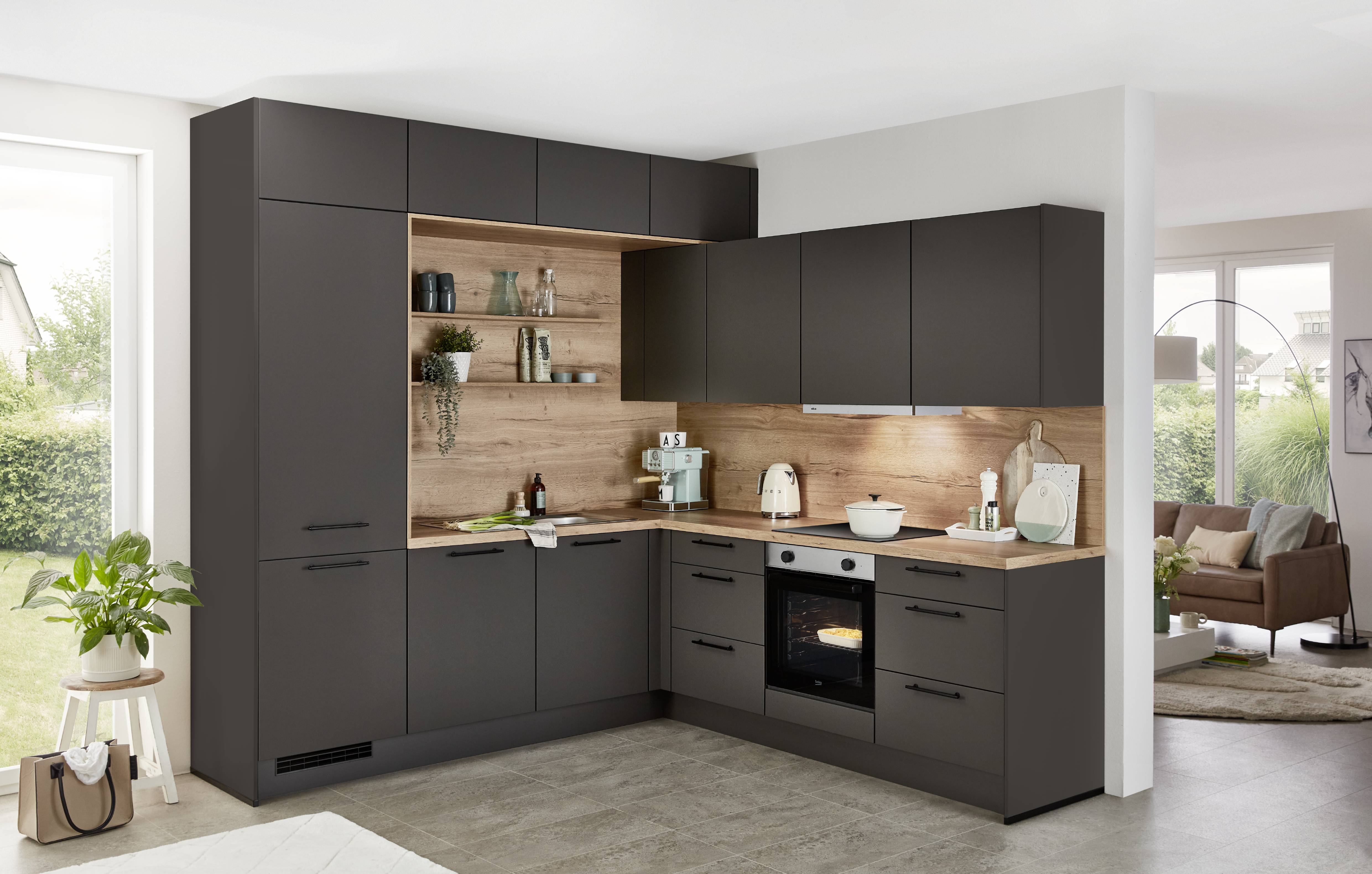 Modern L-shaped kitchen featuring matte black cabinets, warm wood countertops and backsplash, built-in oven, open shelving, under-cabinet lighting, and a minimalist contemporary design in an open-plan home.