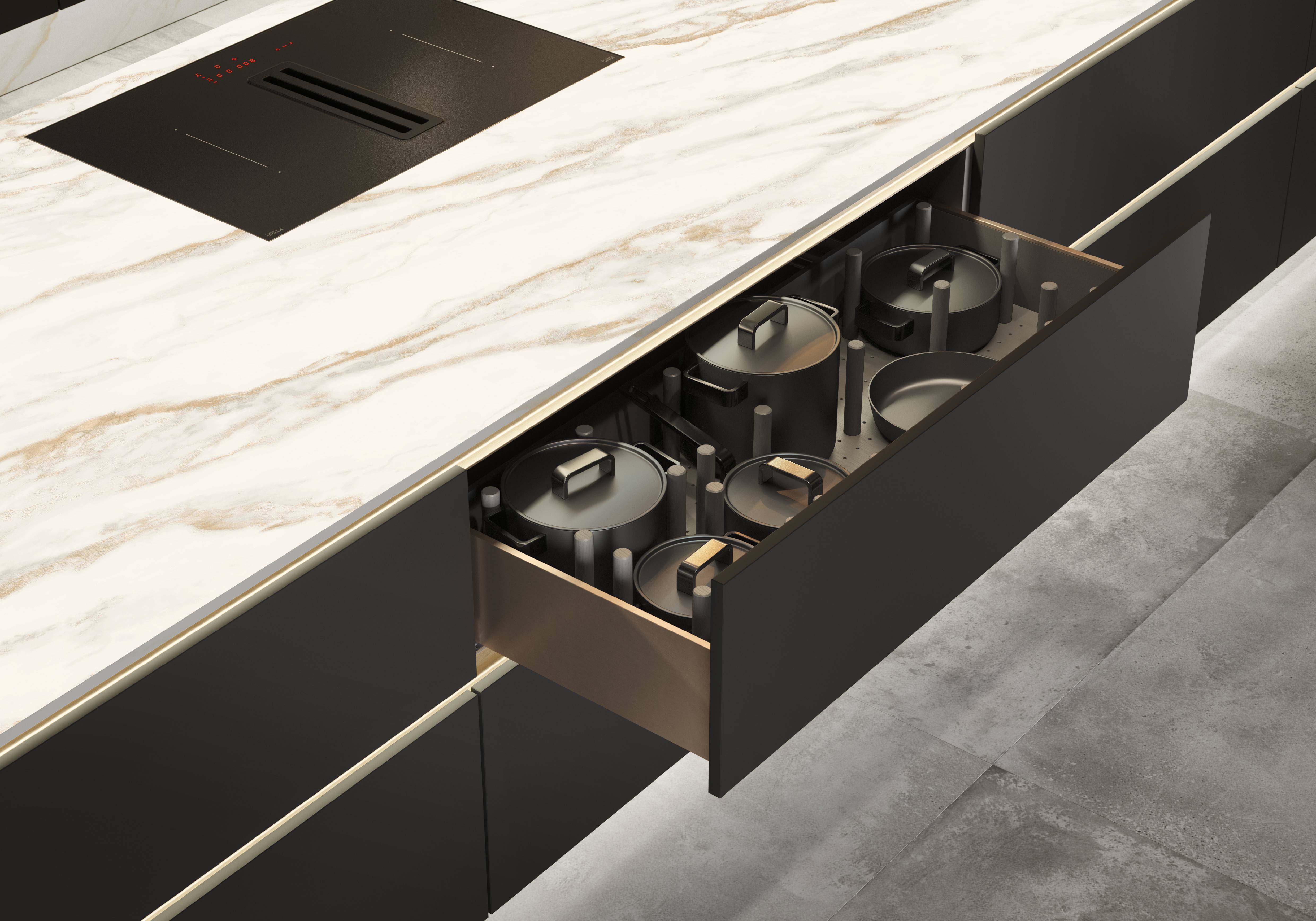 “Modern minimalist kitchen island featuring an integrated induction cooktop and a hidden deep storage drawer with organized cookware, set against sleek matte black cabinetry and elegant marble countertops.