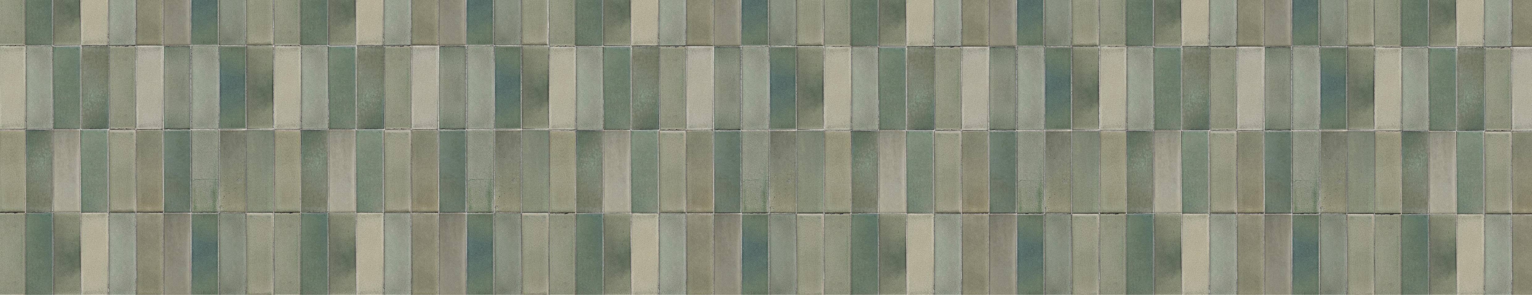 Close-up of a vintage-inspired green decorative tile pattern with varied tones, ideal for a statement kitchen backsplash or accent wall.